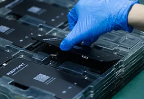 Person wearing blue gloves handling REPART screen replacement